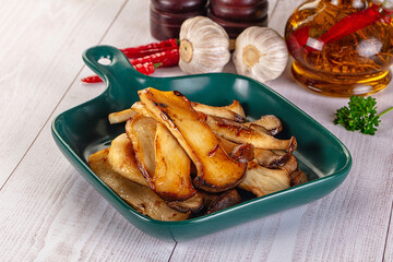 Roasted eringi mushrooms in the plate