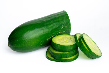 Fresh cucumber and sliced pieces on white background
