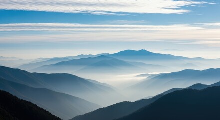Fototapeta premium Misty Mountain Landscape Under a Blue Sky