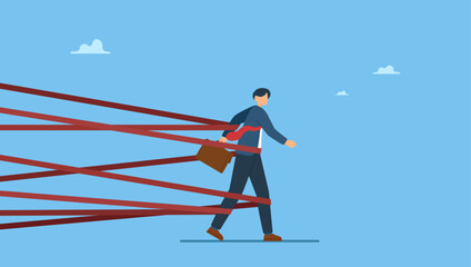 Naklejka premium Businessman tied up with red tape trying to run away with full effort. Business difficulty or struggle with career obstacle, limitation and trap or challenge to overcome to success.