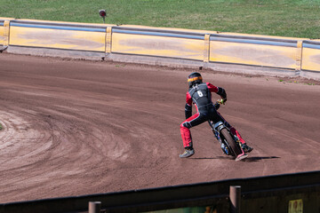 Obraz premium Rear view of a motorcycle in curve during a motorbike racing