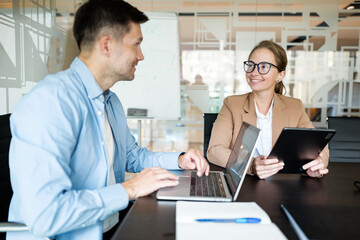 Business meeting between colleagues in a modern office setting