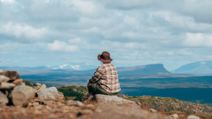woman on the top of the mountain