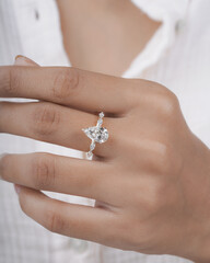 Pear Diamond Gold engagement ring with side diamond for women and girls creative image for ecommerce 