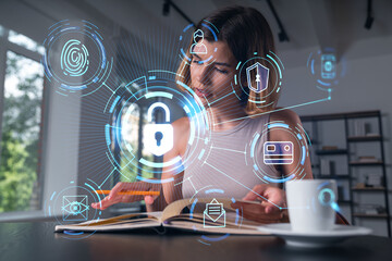 Woman working on cybersecurity tasks with digital security icons overlayed.