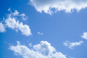 Clear Blue Sky with Puffy White Clouds on a Sunny Day