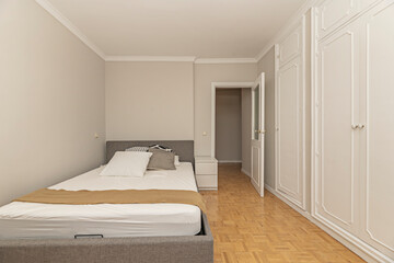 Teen bedroom with a platform bed, study table with laptop shelf, and ergonomic chair
