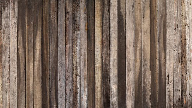 Empty dark brown plank old wooden board background. Beautiful texture and pattern panels from reused pines wood pallet. 16:9 format.