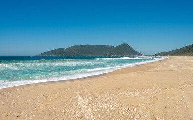 Obraz premium A view of Armação beach on a sunny day - South of Florianopolis island, Brazil
