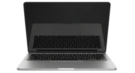 Modern silver laptop with illuminated keyboard and dark screen against a stark black background showcasing technology and digital workspace
