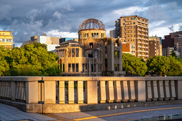 Fototapeta premium Hiroshima Peace Memorial or A-Bomb Dome is the former Hiroshima Prefectural Industrial Promotion Hall and still a few buildings remained standing at Hypocenter atomic bombing of Hiroshima, Japan
