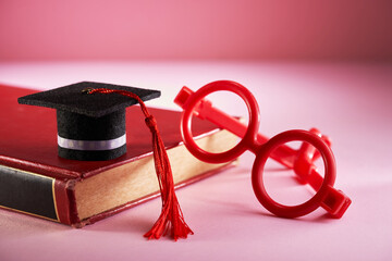 red toy eyeglasses with small mortarboard and book