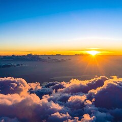 Naklejka premium Sunrise above clouds