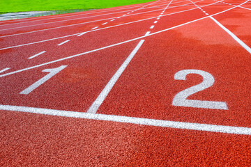 Running track with numbers in the stadium, sport background.