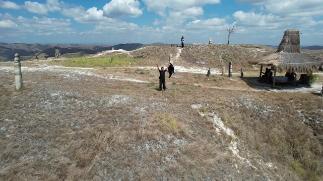 The panorama of the hills on one of the islands in Indonesia, namely Sumba Island, with a drone shot flying backwards, shows the beautiful charm of thousands of evidence on Sumba Island, Indonesia.
