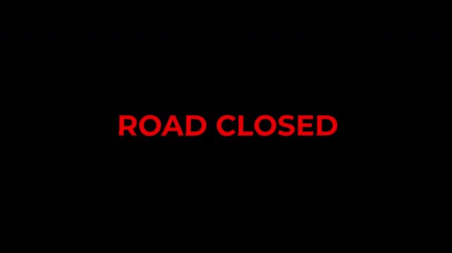 Digital Display Showing Road Closed Alert Message.