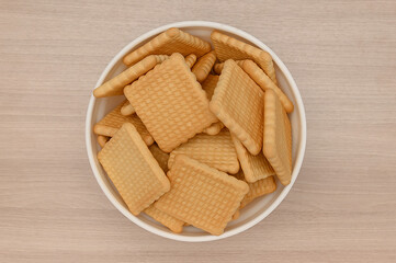Lenten cookies for diabetics on a wooden background on a white plate.