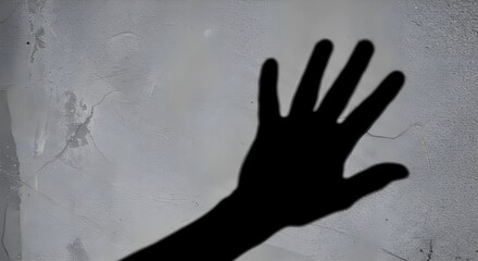 Shadow of hand on wall.