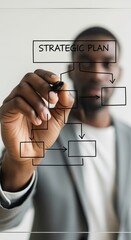 African American man creating strategic plan diagram on glass