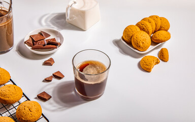 Coffee espresso with chocolate pieces and cookies.