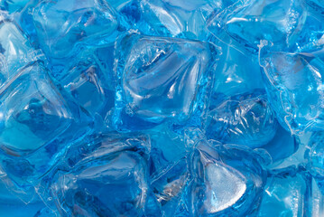 Lots of blue laundry detergent capsules. Washing machine capsule background.