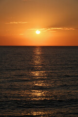 Obraz premium Sunset on the Black Sea in Georgia. Sunset over the sea. Beautiful orange sunset over the sea.