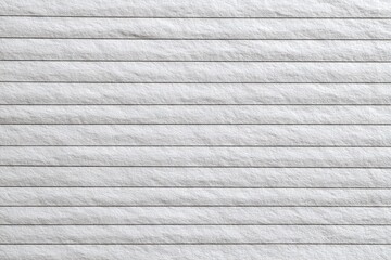 Close-up view of lined paper texture.  Light gray, horizontal lines, subtly textured surface