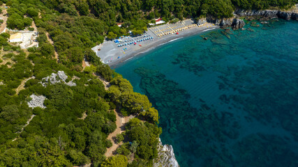 Obraz premium Aerial view of Macarro Beach, located in Maratea, in the province of Potenza, Basilicata, Italy. It's a popular seaside resort overlooking the Mediterranean Sea, with its distinctive black sand beach.