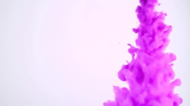 Vibrant Pink Ink Explosion in Water.