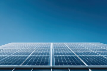 Obraz premium Array of solar panels for clean energy generation with a cloudless blue sky background