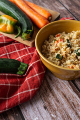 Vegetarian couscous dish with carrots, zucchini, and peppers