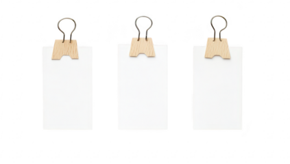 Three blank cards held by wooden clips against a minimalist white background. ideal for designs or messages in a clean. modern aesthetic