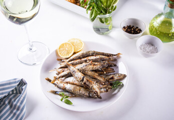 Fried capelin or smelt small fish with lemon