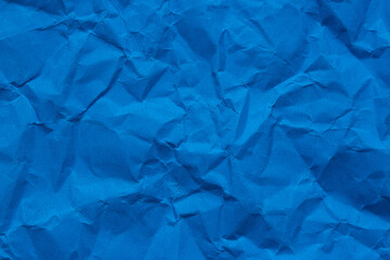Close-up macro of crumpled blue paper texture,crumpled blue paper background texture close up copy space.