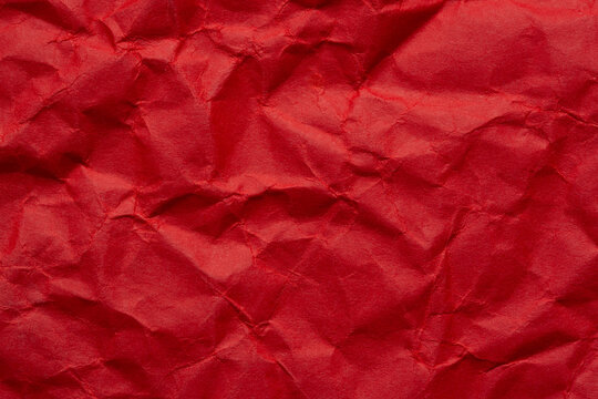 Close-up macro of wrinkled red paper texture,Red crumpled paper texture background for Design. Wallpaper  for copy space.