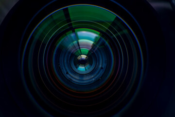 Close-up macro digital camera lens,Photo or video camera lens with light reflections close-up on the black background.