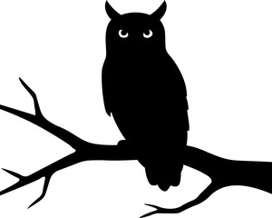 Black silhouette of owl sitting on tree branch
