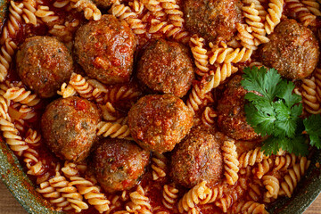 minced meat meatballs, in tomato sauce, with fusilli pasta, in a cast-iron pan, homemade, no people,