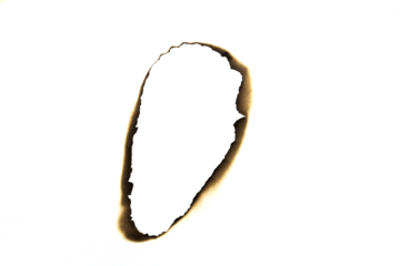 Burnt elongated hole in paper with charred edges isolated on white background with clipping path.