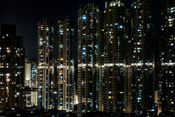 Hong Kong · Night View of High-rise Residential Buildings © Nicholisa