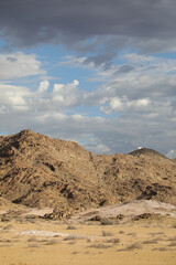 Rugged arid mountains of the Richtersveld desert area with summer storm clouds