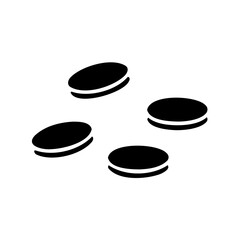 Four black and white round sandwich cookies scattered on a white surface