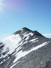 Lone Hiker Reaching Snowy Mountain Summit in the French Alps – Freedom, Success and Adventure on Mont Cenis Ridge