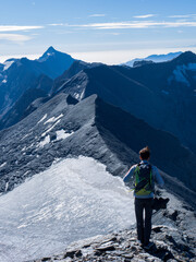 Hiker Standing on Snowy Ridge of Mont Cenis in the French Alps – Freedom, Exploration and Alpine Adventure