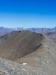 Two Hikers Walking on Mountain Ridge in the French Alps – Adventure and Exploration on Mont Cenis Peaks