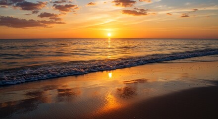 Fototapeta premium Sunset over Reflective Wet Sand with Foamy Waves and Vibrant Sky Hues