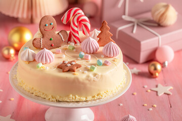 White Christmas cake for Christmas with cookies and gingerbread.