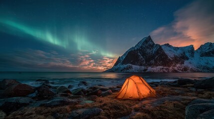 Mountains Snow. Camping Adventure in Lofoten with Aurora Above Sea and Sky