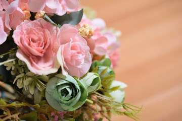 A photograph of beautiful flowers arranged in a vase, taken indoors