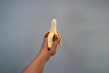 Hand holding a banana